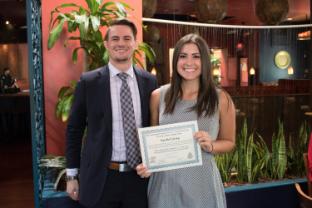 Photo of senior student Rachel Gray receiving an award